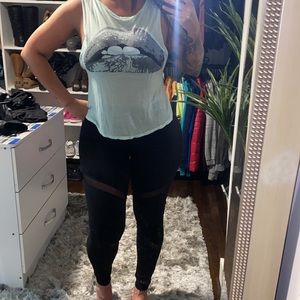 Mint green tee with bitting lip logo